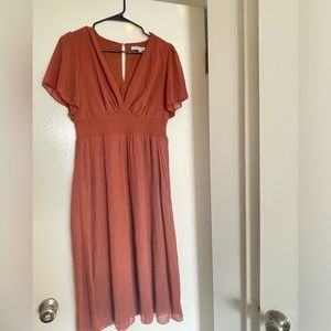 Medium rust colored dress - ordered online but never wore - no tags